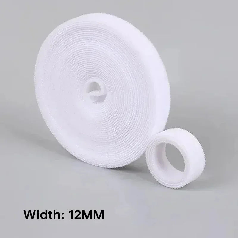 Roll of white cable tie with a width of 12MM on a gray background