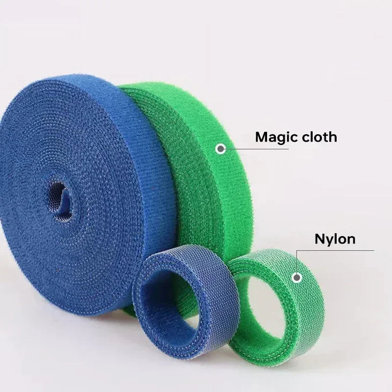 Two rolls of blue and green cloth tape labeled 'Magic cloth' and 'Nylon' on a white background.