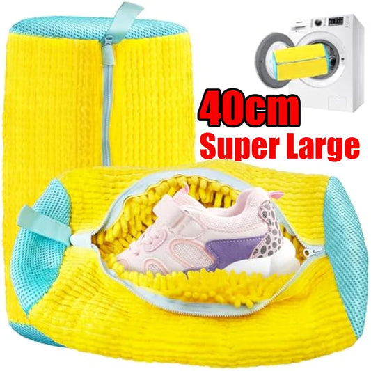 Yellow mesh laundry bag with blue zipper, containing a shoe, with a washing machine icon and text '40cm Super Large' in the background.