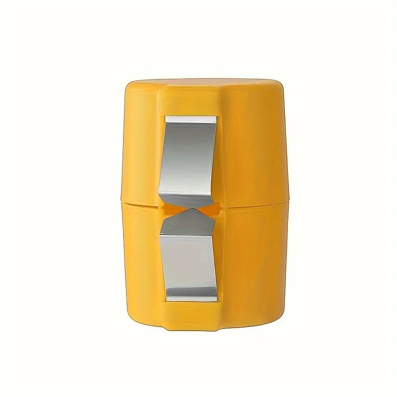 Yellow egg shell cracker with a silver lid on a white background